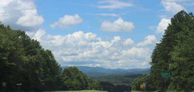 A scenic drive on a sunny day in Blue Ridge Georgia, with a...