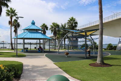 Lush palm trees frame a vibrant playground near Lido Key, FL on...