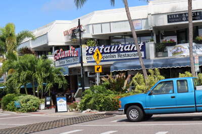 A bustling street in St Armends Circle on Lido Key, FL lined...