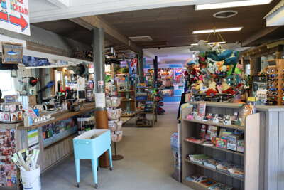A vibrant Ocean Isle Beach pier gift shop offers a variety of...