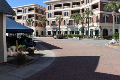 Several redbrick pathways lead to multi-story buildings flanked...