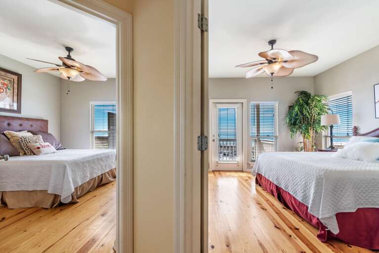 Two bedrooms feature light wood floors, tropical leaf ceiling fans, white bedding, and windows with ocean views.