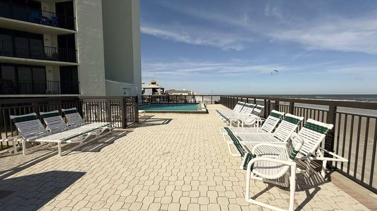 Ocean Trillium 303 (OT303) - New Smyrna Beach - Condo complex offers an oceanfront pool, an outside shower, elevator, credit card operated washer/dryer on-site, and private beach access