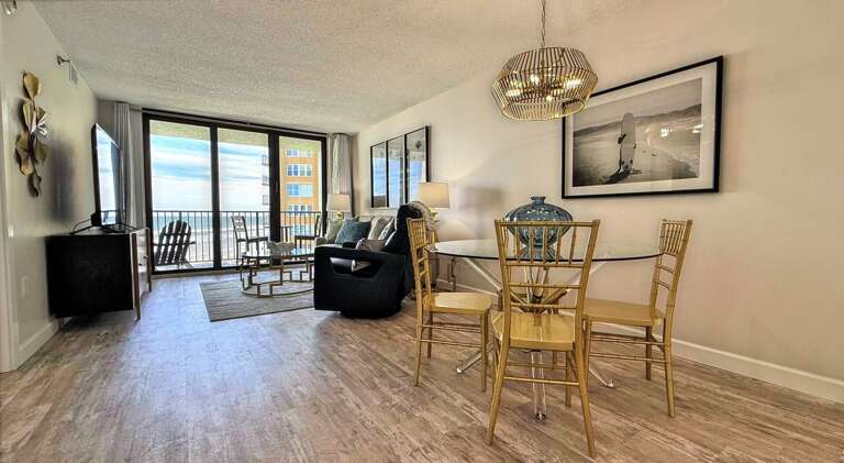 Ocean Trillium 303 (OT303) - New Smyrna Beach - Eat your meals in luxury in the bright dining area which seats 4 - Expansive glass windows are a stunning backdrop as you unwind