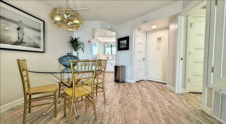 Ocean Trillium 303 (OT303) - New Smyrna Beach - Eat your meals in luxury in the bright dining area which seats 4 - Freshly renovated fully equipped kitchen boasts granite counters