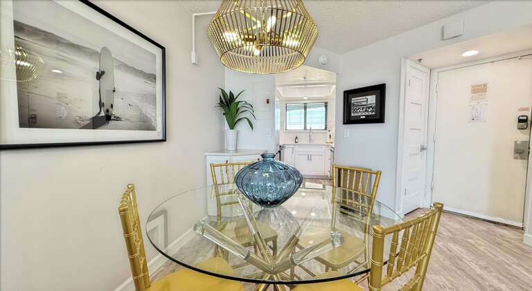 Ocean Trillium 303 (OT303) - New Smyrna Beach - Eat your meals in luxury in the bright dining area which seats 4 - Freshly renovated fully equipped kitchen boasts granite counters