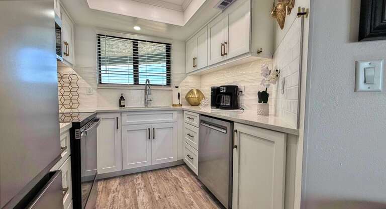 Ocean Trillium 303 (OT303) - New Smyrna Beach - Freshly renovated fully equipped kitchen boasts granite counters - Starter Supplies