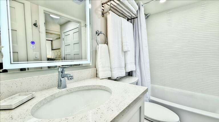 Ocean Trillium 303 (OT303) - New Smyrna Beach - Tub and Shower Combo Bathroom - Bidet on Comfort Height Elongated Toilet - Slow Close Toilet Seat - Lighted Vanity Mirror - Hairdryer - Starter Supplies