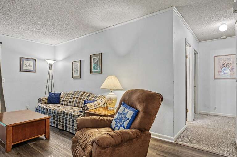 Sink into the plush recliner or stretch out on the cozy plaid sofaâyour perfect retreat for movie nights and leisurely mornings awaits.