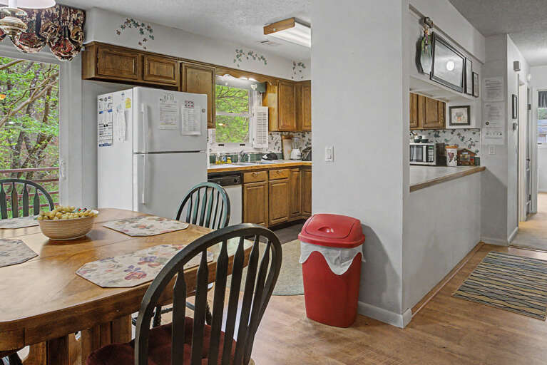 Step into a welcoming open kitchen and dining space where you'll love gathering for home-cooked meals, with natural light from the window view and all the essentials ready for your stay.