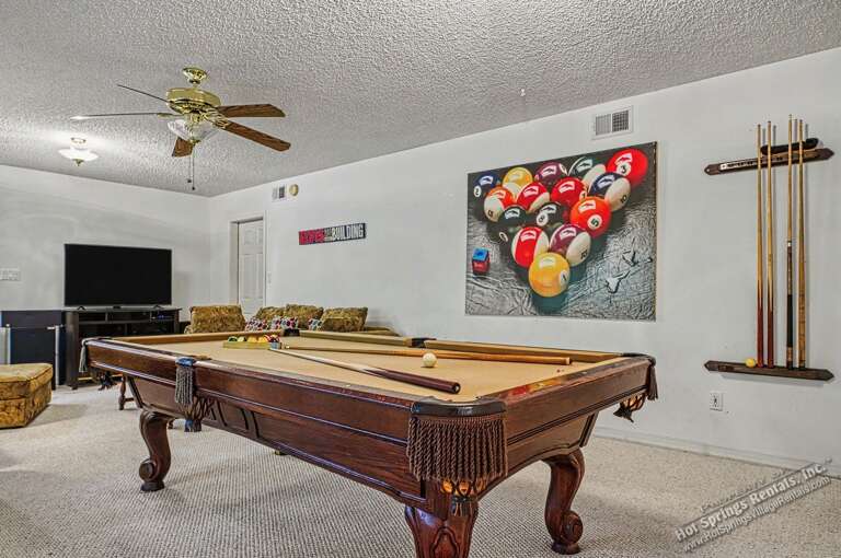 Challenge friends to a game on your private billiards table. A full-sized pool table awaits in your dedicated game room, complete with cue sticks and a cozy seating area.