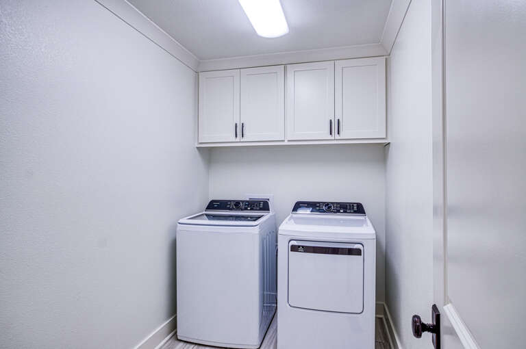 Your dedicated laundry room features full-size washer and dryer with ample cabinet storage for all your vacation essentials.