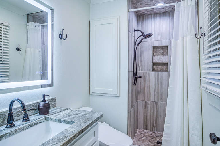 Step into your spa-like ensuite with elegant granite counters and a luxurious rainfall shower to refresh after your adventures.