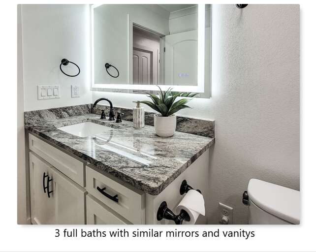 Your modern bathroom features elegant granite countertops, LED-lit mirror, and premium fixtures for your comfort.