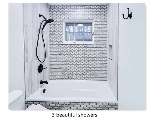 Step into your stylish bathroom featuring a spa-like tub-shower combo with designer mosaic tiles and crisp white finishes.