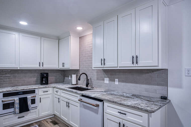 Your fully equipped kitchen awaits with granite counters, modern appliances, and everything you need to prepare memorable meals.