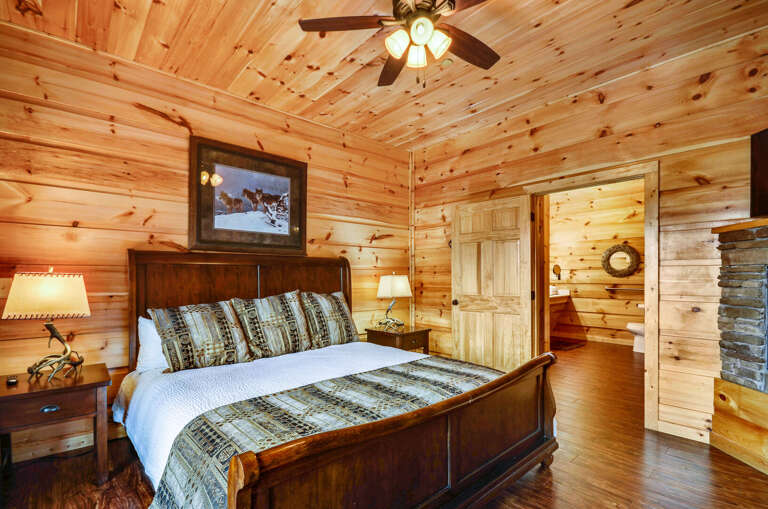 Bedroom with a large bed and twin nightstands.