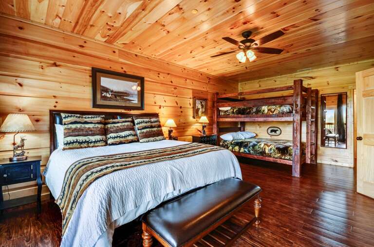 Full bed and bunk bed in a bedroom.