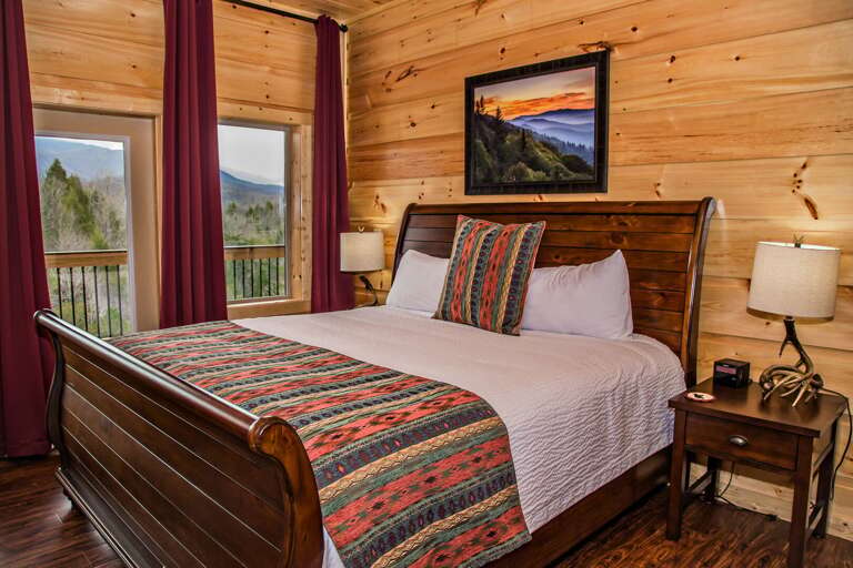 Large Bed, Nightstands, Table Lamps, and Windows.