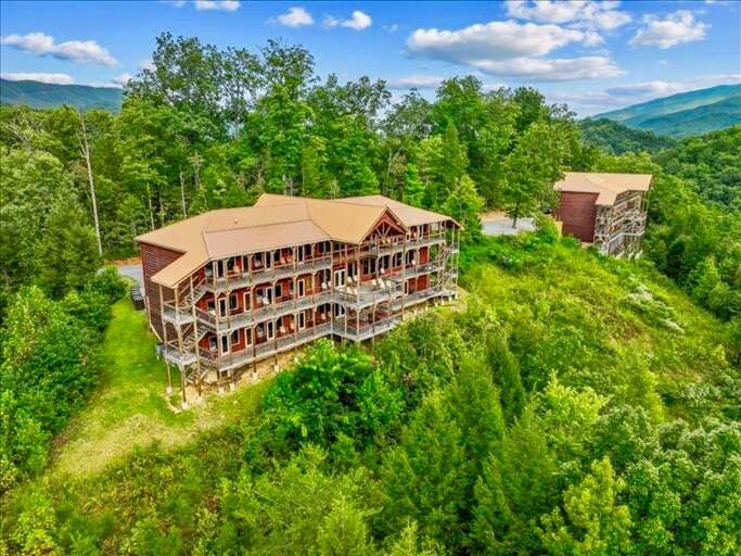 Picture 2 World-Class, Luxury 14 bedroom cabins, nestled side by side atop 10 acres, with stunning
mountain views!