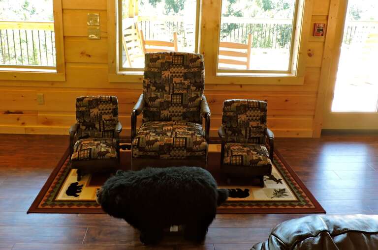 Seating Area with Arm Chair, Children's Chairs, and Windows.