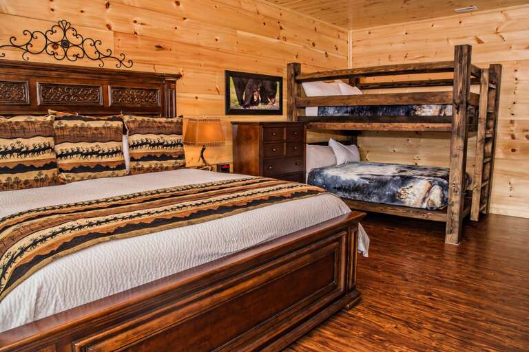 Bedroom Includes Large Bed and a Bunk Bed. Bedroom Includes Large Bed and a Bunk Bed.