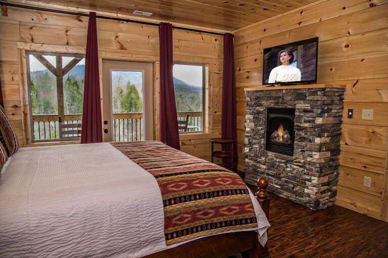 Guests Can Enjoy a Fireplace and TV in Bedroom. Guests Can Enjoy a Fireplace and TV in Bedroom.