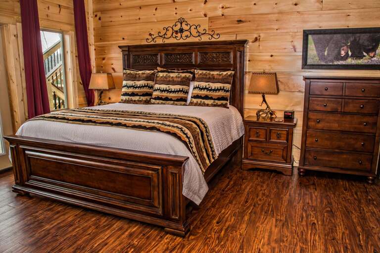 Image of Bed, Side Table, and Dresser in Bedroom. Image of Bed, Side Table, and Dresser in Bedroom.