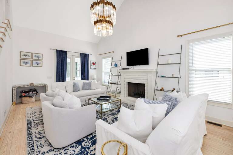 Light-filled Living Space With Plush Seating And Fireplace