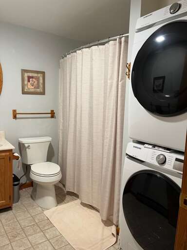 2nd full bathroom with stackable washer and dryer. - full size. 2nd full bathroom with stackable washer and dryer. - full size.