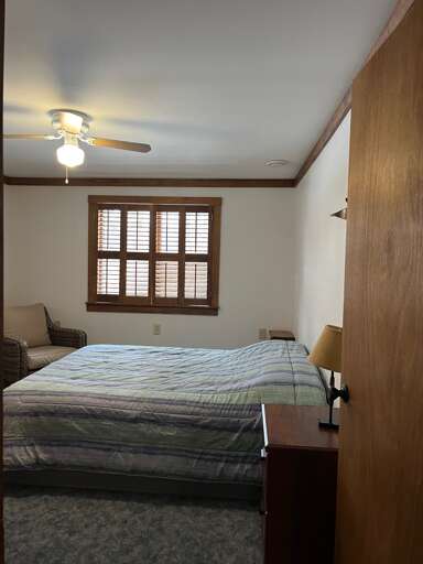 first floor queen bed in bedroom