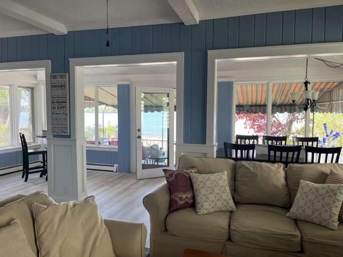spacious living area with lake and beach views