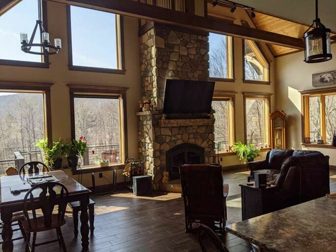 Open living space in the ellicottville chalet with incredible fireplace