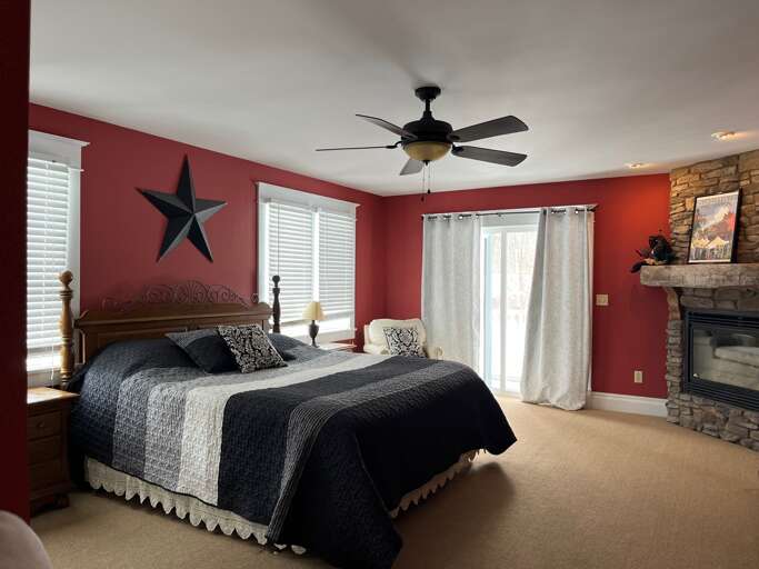 King bedroom with Gas Fireplace and out door deck King bedroom with Gas Fireplace and out door deck