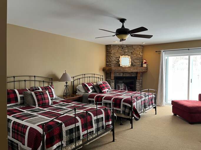 Two Queen beds with outdoor patio and gas fireplace Two Queen beds with outdoor patio and gas fireplace