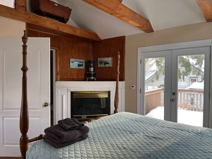Master bedroom with full bath, deck and fireplace Master bedroom with full bath, deck and fireplace