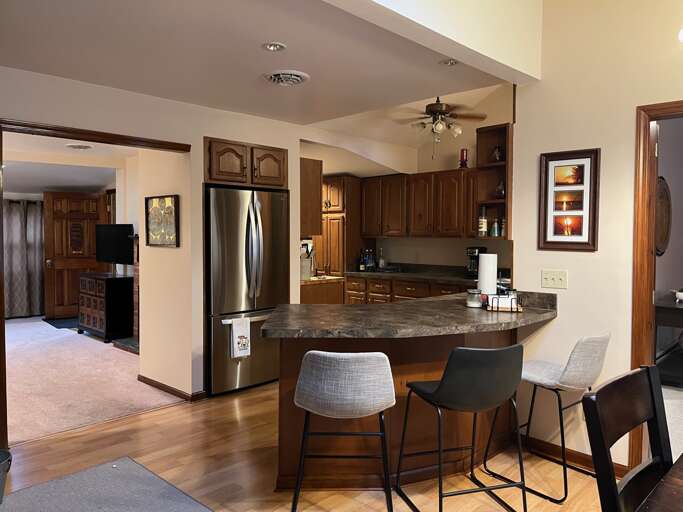 Kitchen area with bar seating Kitchen area with bar seating