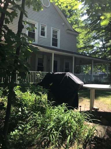VIEW FROM SIDE OF HOUSE INCLUDING WEBER GAS GRILL