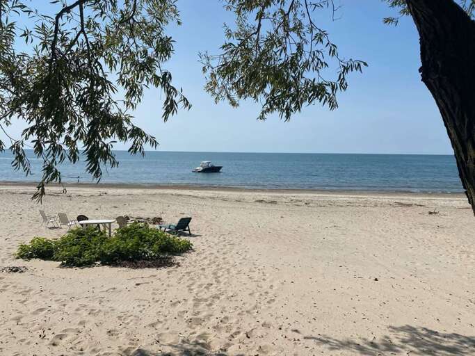 Boat anchored in the water at the Angola Beach House