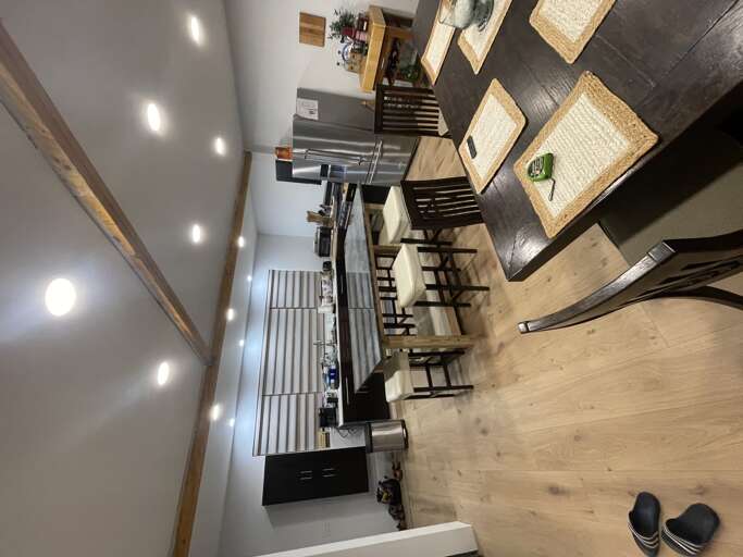 Dining and Kitchen Island Area | Angola on the Lake Beach House