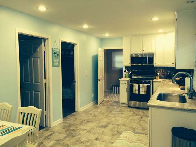 Kitchen Area and Doors to the Bedrooms and Bathroom