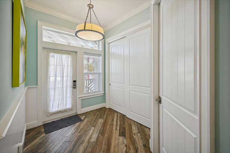 Brightly-bordered Breezeway In A Vacation Rental, Showcasing Sleek Surfaces And Subtle Shades