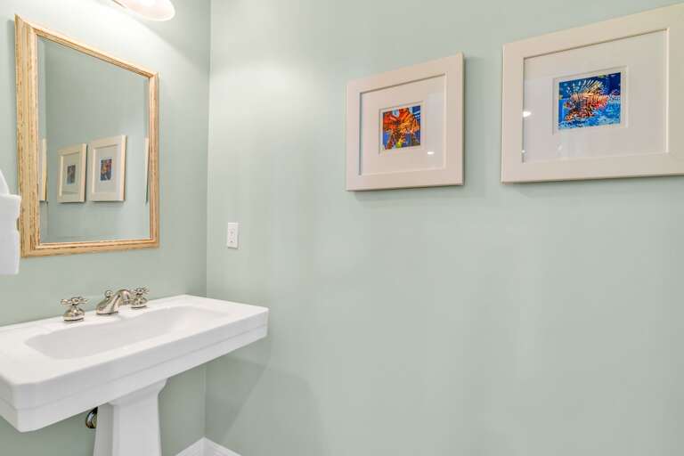 Stylish guest bathroom in a Marathon FL waterfront vacation rental offering elegant design, modern fixtures, and relaxing Florida Keys ambiance.
