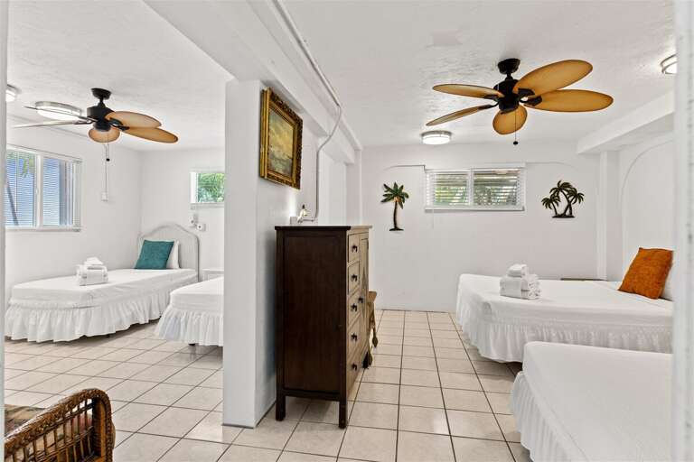 1st level bedroom 4 with 2 queen beds and 2 twin beds.