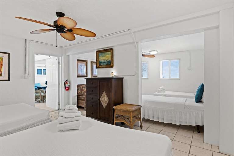 1st level bedroom 4 with 2 queen beds and 2 twin beds.