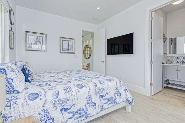 1st level master suite 1 with a King bed.