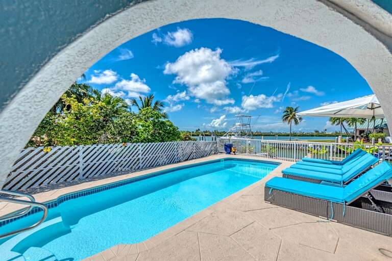 Arch way leading out to the beautiful pool