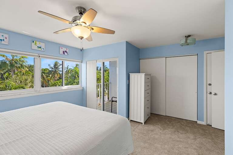 3rd level bedroom 2 with a king bed and an ensuite bath.