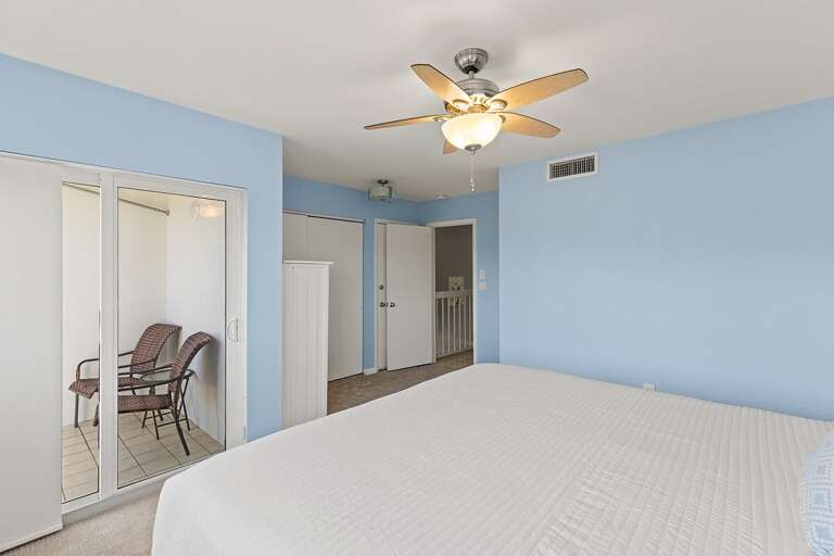 3rd level bedroom 2 with a king bed and an ensuite bath.