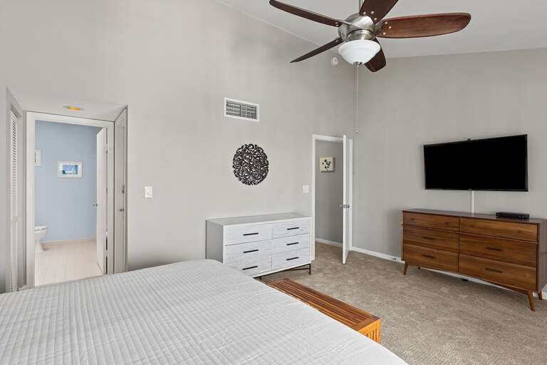 3rd level master suite with a king bed and an ensuite bath.